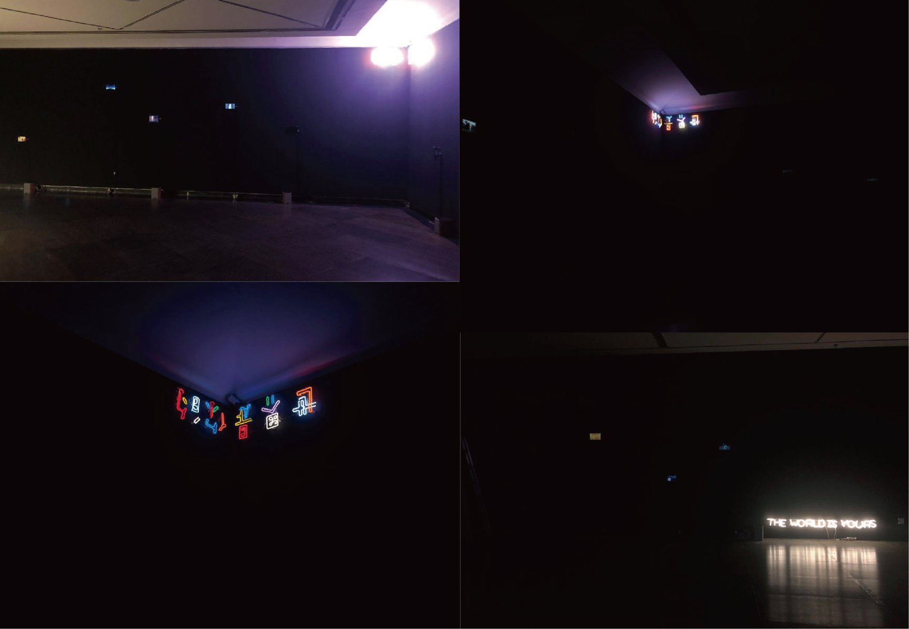 Simulated installation: small screens scattered in a dark hall; a corner neon of fractured glyphs; a white floor neon reading THE WORLD IS YOURS.